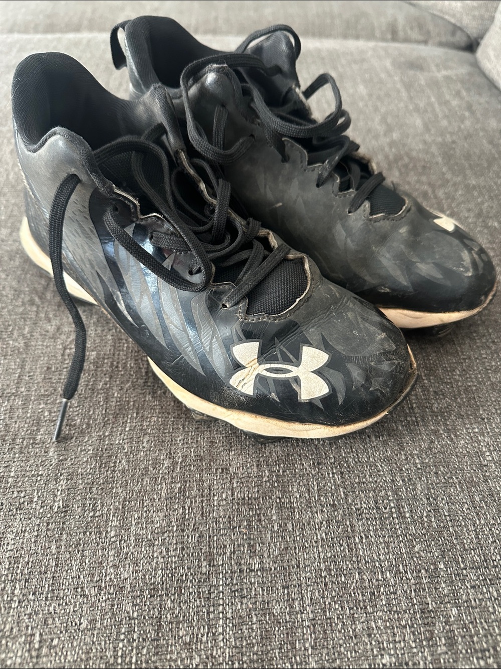 Under Armour Black and White Kids Athletic Cleats